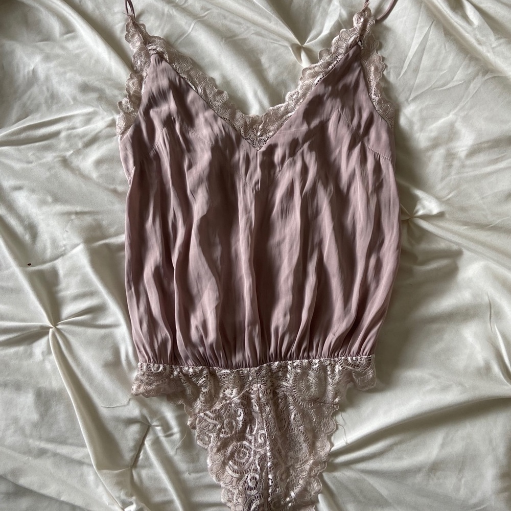 Saints + Secrets blush pink bodysuit